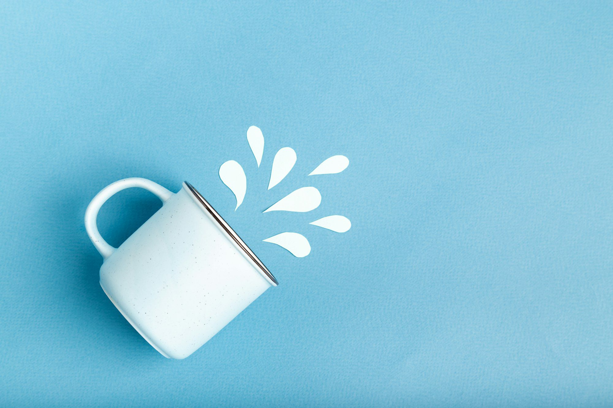 World water day concept with mug and paper cut water splashes